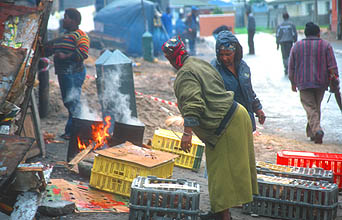 Cape Town Townships women preparing cooked chicken 1
