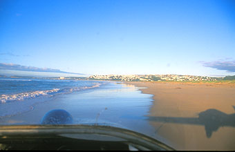Plettenberg Bay Stanley Island Backpackers motorized glider flying low over the beach