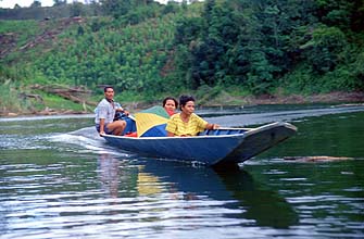 Iban Longhouses: boat crossing on a jungle river