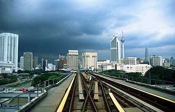 Putra LRT elevated section with dark clouds