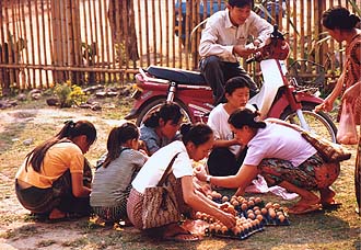 Women buying eggs, Ban Phanom (near Luang Prabang)