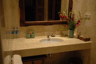 DPS Bali Ubud Bedulu Gubah Bali Exclusive Villas bathroom wash basin with flowers 3008x2000