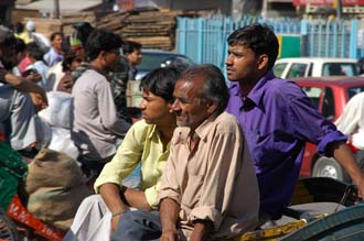 DEL Delhi - Chandni Chowk street shopping bazaar people sitting on rickshaw and waiting 3008x2000