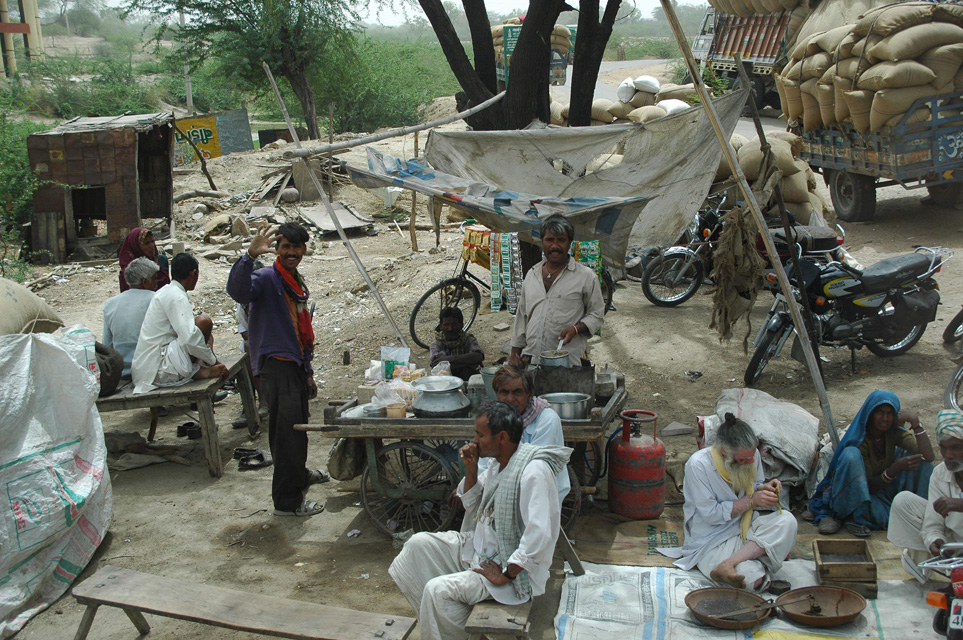 JAI - men joining around a foodstall in a small market village on the road from Jaipur to Ranthambore National Park 3008x2000