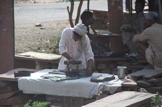 JAI - man ironing clothes with antique flat iron on the road from Ranthambore National Park to Karauli 3008x2000