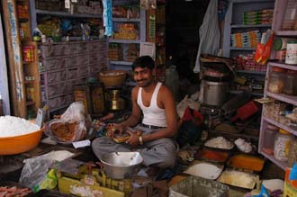 JAI Karauli in Rajasthan - friendly owner of a shop selling spices and small household articles 3008x2000