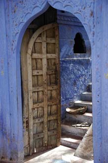 JAI Karauli in Rajasthan - wooden door on blue house with stairs 3008x2000