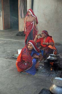 DEL Mandawa in Shekawati region - women in traditional dress preparing indian chai tea 3008x2000