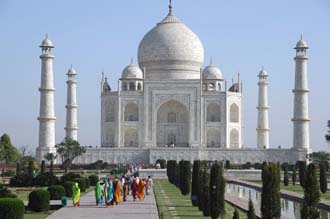 AGR Agra - Taj Mahal panorama with watercourse and indian visitors after sunrise 3008x2000