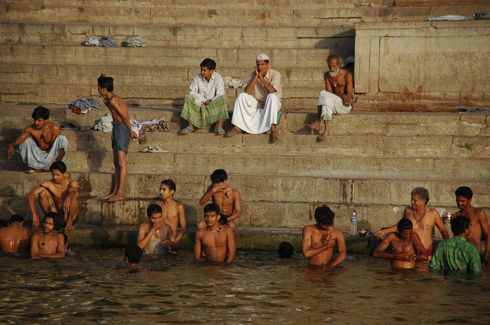 VNS Varanasi or Benares - Hindu men taking a bath in the holy Ganges river at sunrise 3008x2000