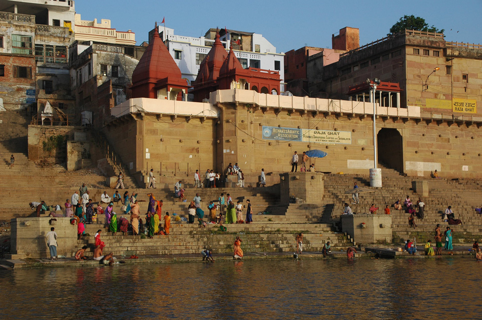 VNS Varanasi or Benares - Hindu pilgrims taking a bath in the holy Ganges river at sunrise at Raja Ghat 3008x2000