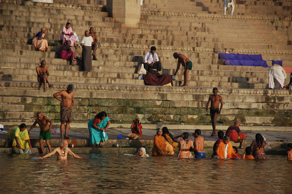 VNS Varanasi or Benares - Hindu pilgrims taking a bath in the holy Ganges river at sunrise at Raja Ghat detail 3008x2000