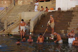 VNS Varanasi or Benares - Hindu men taking a bath in the holy Ganges river at sunrise at Darshan Ghat 3008x2000