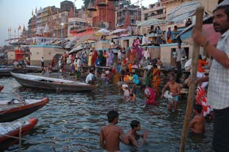 VNS Varanasi or Benares - Hindu pilgrims taking a bath in the Ganges river at dawn 3008x2000