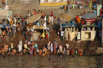VNS Varanasi or Benares - masses of Hindu pilgrims in colourful clothes taking a bath in the  Ganges river at sunrise at Dasaswamedh Ghat 02 3008x2000