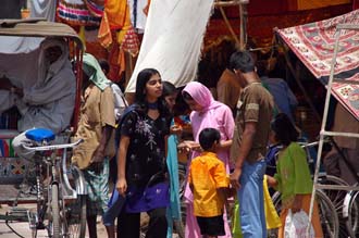 VNS Varanasi or Benares - pilgrims in colourful dress outside Durga Temple 3008x2000