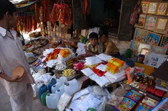 VNS Varanasi or Benares - shop selling articles for religious hindu ceremonies near Dasaswarmedh Ghat 3008x2000