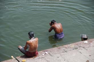 VNS Varanasi or Benares - washing and taking a ritual bath in the holy waters of river Ganges near Harishchandra Ghat 3008x2000