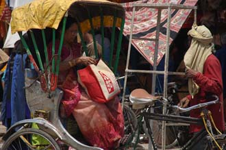 VNS Varanasi or Benares - woman in cycle-rickshaw outside Durga Temple 3008x2000