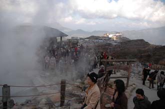 NRT Hakone - Owakudani volcanic hot springs panorama with steam and people on cable-car or ropeway line between Soun-zan and Togendai 3008x2000