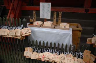 KIX Nara - small shrine Votive plaques or ema made of wood where visitors can write a wish 02 3008x2000