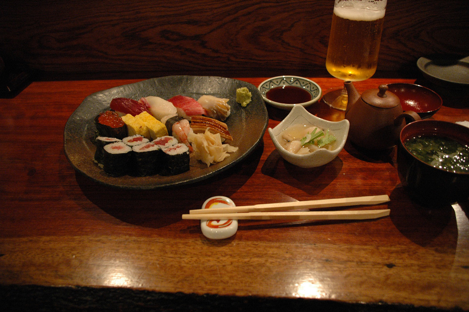 NRT Shinjuku Tokyo - Sushi meal with shoyu dip japanese beer chopsticks gari or pickled ginger and green seaweed soup 3008x2000