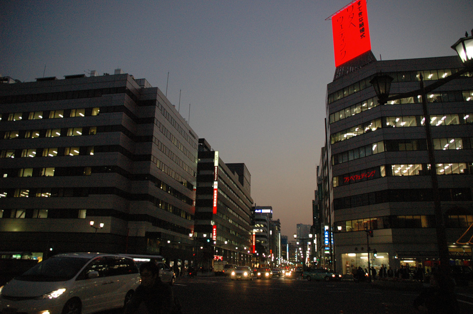 NRT Tokyo - Ginza shopping area with department stores and colourful advertisement lights by night 01 3008x2000