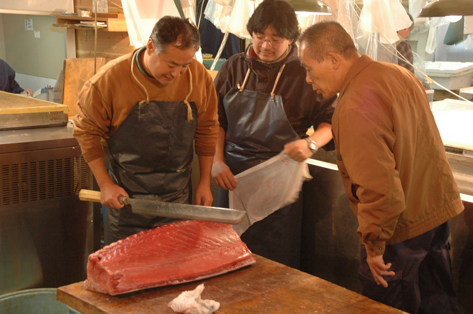 NRT Tokyo - Tsukiji Fish Market cutting fresh tuna for sushi and sashimi  production 01 3008x2000