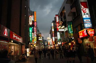 NRT Shibuya Tokyo - youth-oriented shopping district by night with colourful advertisement lights 02 3008x2000