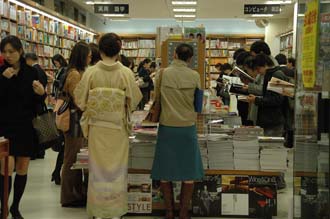 NRT Tokyo - Ginza shopping area people reading magazines in a bookshop 3008x2000