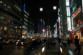 NRT Tokyo - Ginza shopping area with department stores and colourful advertisement lights by night 02 3008x2000