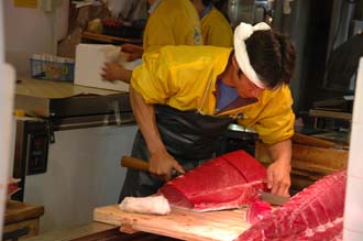 NRT Tokyo - Tsukiji Fish Market cutting fresh tuna for sushi and sashimi  production 02 3008x2000
