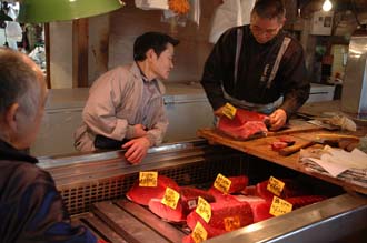 NRT Tokyo - Tsukiji Fish Market cutting fresh tuna for sushi and sashimi  production 03 3008x2000