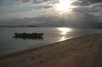 AMI Lombok Ombak Putih sailing ship Gili Lampu Island beach with boat at sunset 3008x2000