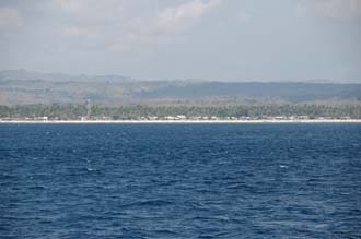 AMI Lombok Ombak Putih sailing ship Nusa Lembongan island with village 3008x2000