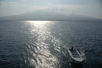 AMI Lombok Ombak Putih sailing ship approaching Gili Lampu Island with Lomboks Mount Rinjani in background 3008x2000