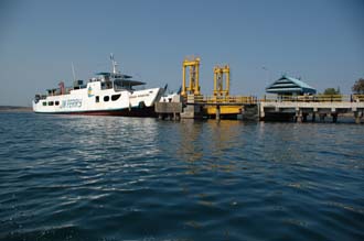 AMI Lombok Ombak Putih sailing ship in Labuhan Kayangan harbour ferry docking on the pier 3008x2000