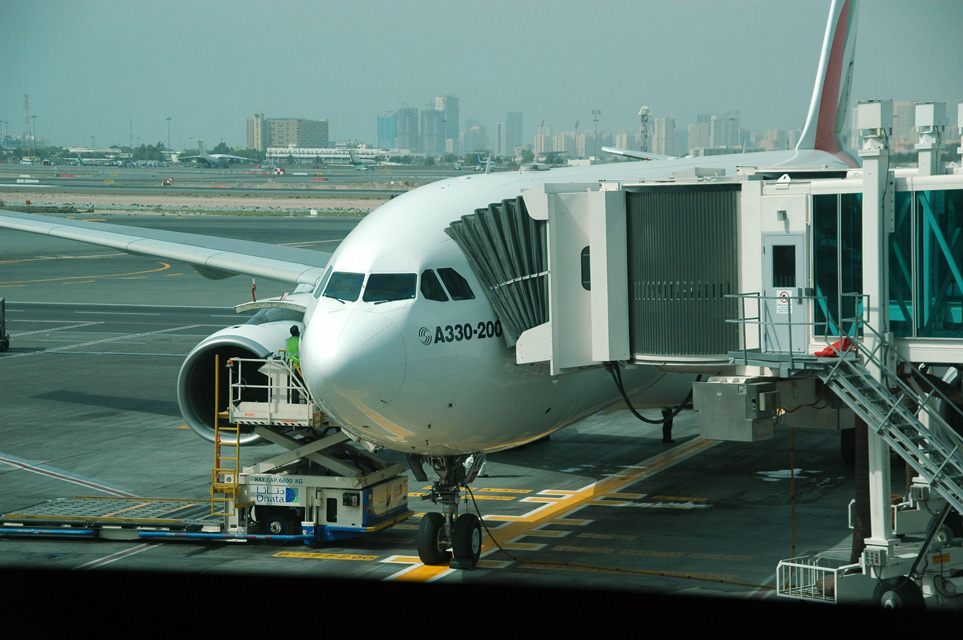 DXB Dubai International Airport - Emirates Airlines Airbus A330-200 aircraft at the gate in Terminal 1 detail 3008x2000