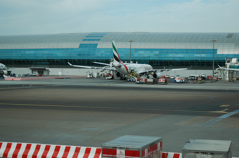 DXB Dubai International Airport - Terminal 1 with Emirates Airlines Airbus A330-200 aircraft at the gate 03 3008x2000