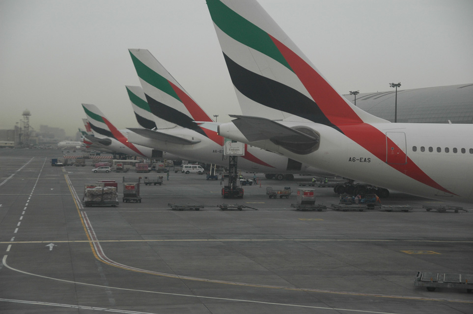 DXB Dubai International Airport - Terminal 1 with Emirates Airlines aircrafts at the gate 3008x2000