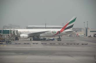 DXB Dubai International Airport - Emirates Airlines Boeing 777 aircraft at the gate 3008x2000