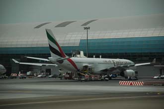 DXB Dubai International Airport - Terminal 1 with Emirates Airlines Airbus A330-200 aircraft at the gate 01 3008x2000