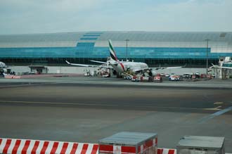 DXB Dubai International Airport - Terminal 1 with Emirates Airlines Airbus A330-200 aircraft at the gate 03 3008x2000