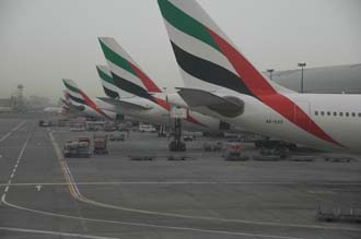 DXB Dubai International Airport - Terminal 1 with Emirates Airlines aircrafts at the gate 3008x2000