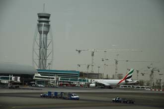 DXB Dubai International Airport - Terminal 1 with Tower and aircrafts at the gates 01 3008x2000