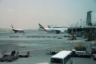 DXB Dubai International Airport - Terminal 1 with Tower and aircrafts at the gates 03 3008x2000