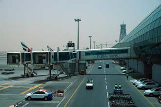 DXB Dubai International Airport - Terminal 1 with Tower and aircrafts at the gates 04 3008x2000