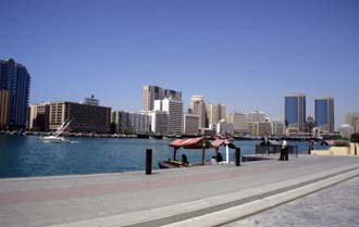 DXB Dubai creek - Bur Dubai promenade panorama with Deira skyline and abra boats 5340x3400