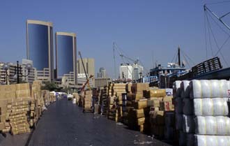DXB Dubai - Deira dhow wharfage with cargo and twin towers 01 5340x3400