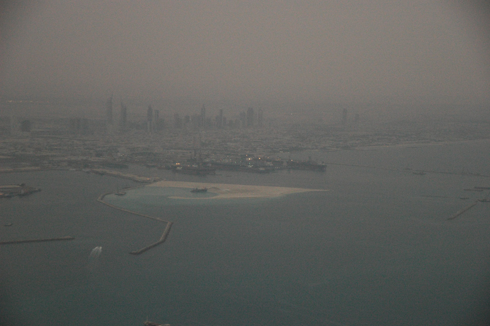 DXB Dubai from aircraft - Port Rashid land reclaiming and the Jumeirah skyscrapers at dawn 01 3008x2000